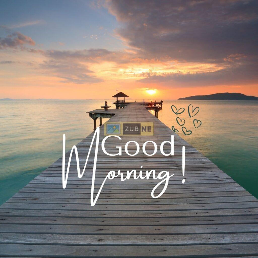 a wooden deck next to ocean, good morning image by zubne.com
